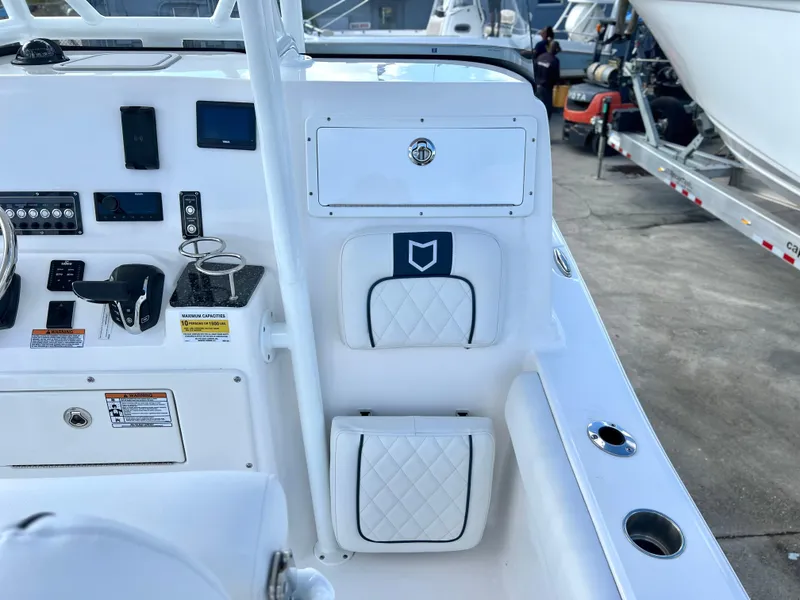 Slide: The Image of 2025 Sea Fox 248 Side Console boat interior with control panel and seating. - 38