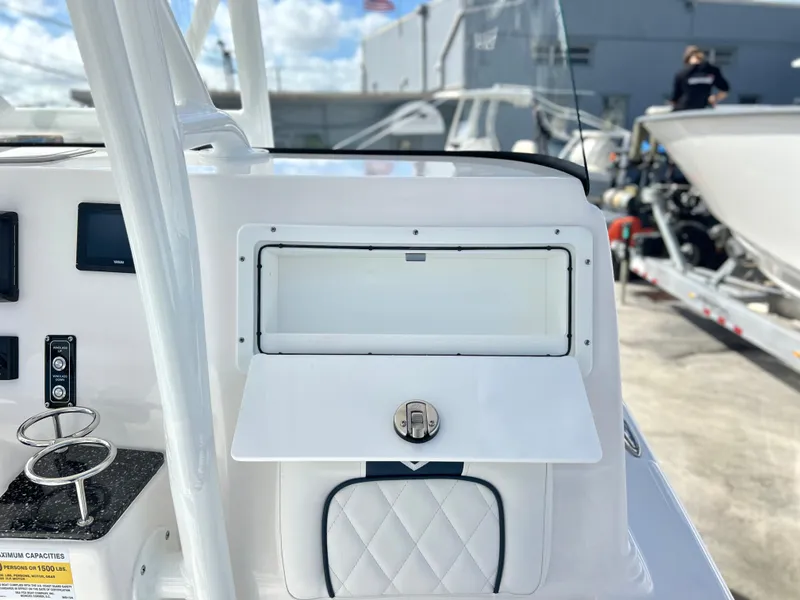 Slide: The Image of 2025 Sea Fox 248 Side Console boat interior with storage compartment and control panel. - 40