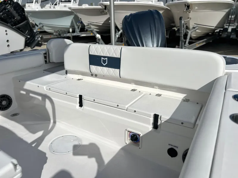 Slide: The Image of 2025 Sea Fox 248 Side Console boat interior with seating and storage compartments. - 43