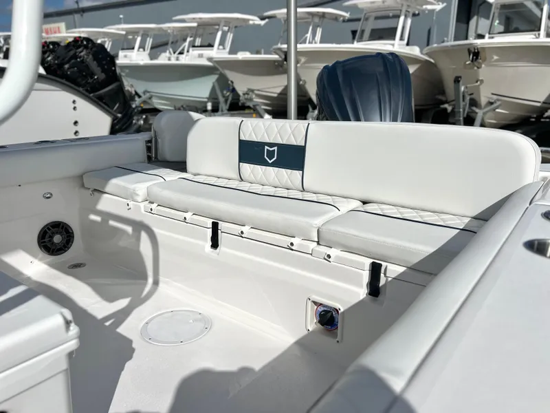 Slide: The Image of 2025 Sea Fox 248 Side Console boat interior with white seating and modern design. - 44