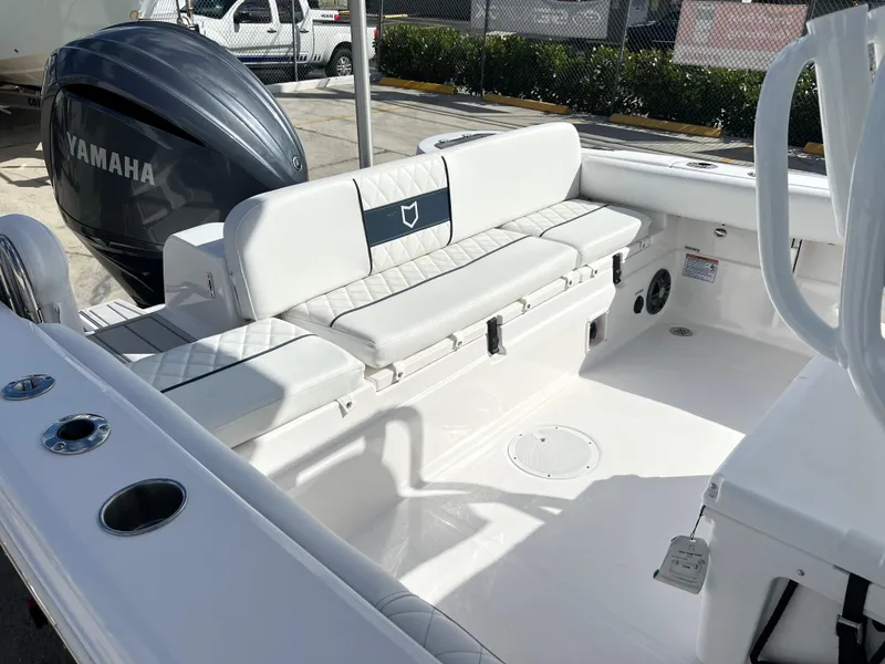Slide: The Image of 2025 Sea Fox 248 Side Console boat interior with Yamaha engine, featuring white seating and spacious layout. - 45
