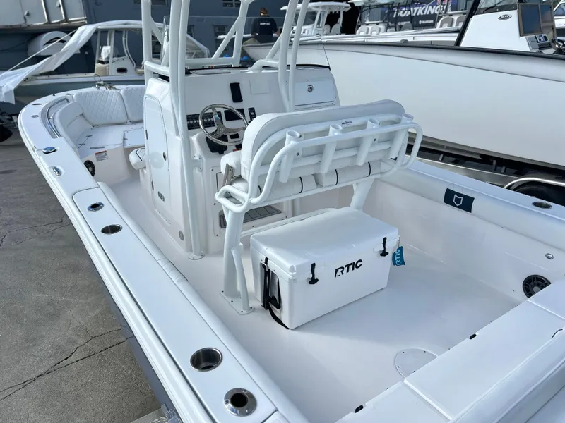 Slide: The Image of 2025 Sea Fox 248 Side Console boat interior with seating and RTIC cooler. - 49