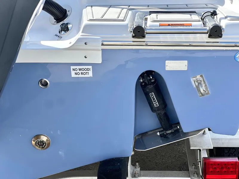 Slide: The Image of 2025 Sea Fox 248 Side Console boat transom with "No Wood! No Rot!" label. - 5