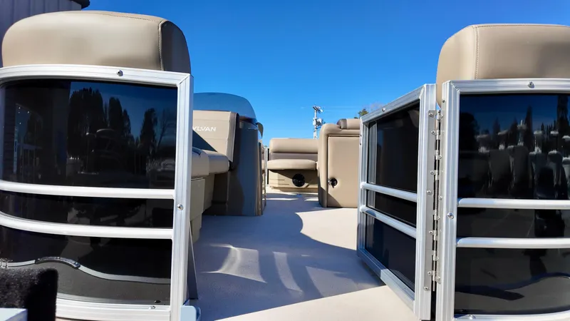 Slide: The Image of 2025 Sylvan Mirage 820 CRS pontoon boat interior with beige seating and open deck. - 3