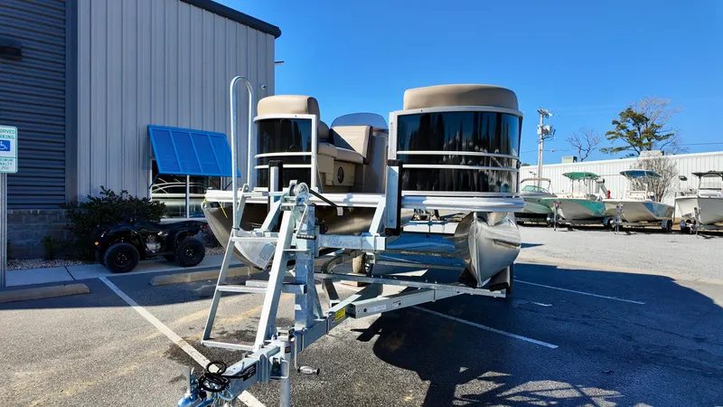 Slide: The Image of 2025 Sylvan Mirage 820 CRS pontoon boat on trailer in parking lot. - 4