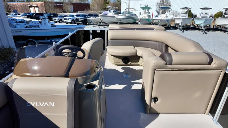 Slide: The Image of 2025 Sylvan Mirage 820 CRS pontoon boat with spacious seating and modern design. - 5
