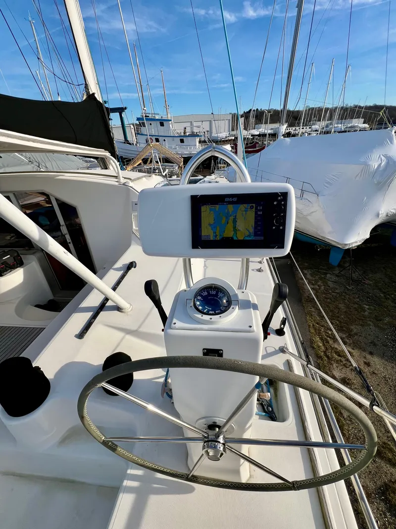 Slide: The Image of Steering wheel and navigation system on a 2003 Catana 431 sailboat. - 12