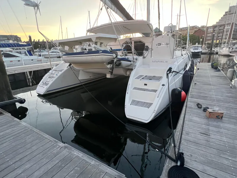 Slide: The Image of 2003 Catana 431 catamaran docked at marina during sunset. - 3