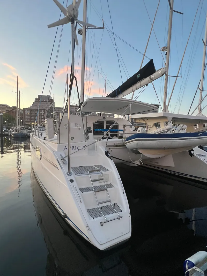 Slide: The Image of 2003 Catana 431 catamaran docked at marina during sunset. - 7