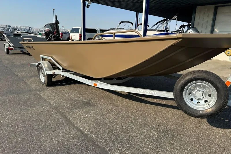 The Image of 2025 Smoker Craft Sportsman Pro 1866 boat on trailer, parked outdoors. - 0