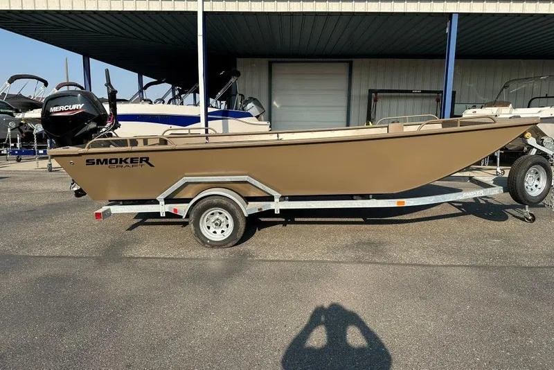 Slide: The Image of 2025 Smoker Craft Sportsman Pro 1866 boat on trailer, parked outdoors. - 1