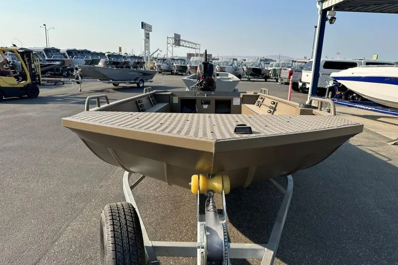 Slide: The Image of 2025 Smoker Craft Sportsman Pro 1866 boat on trailer at dealership. - 2