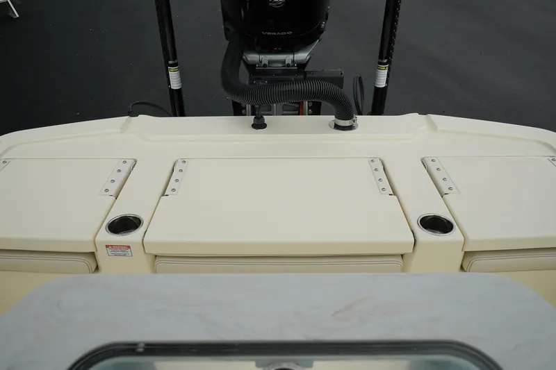 Slide: The Image of 2025 Scout 261 XSS boat deck with storage compartments and cup holders. - 30