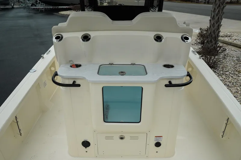 Slide: The Image of 2025 Scout 261 XSS boat interior with storage and rod holders. - 31