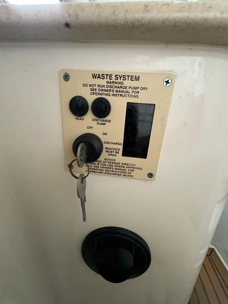 Slide: The Image of Control panel for waste system on 2008 Sea Ray 310 Sundancer boat. - 15