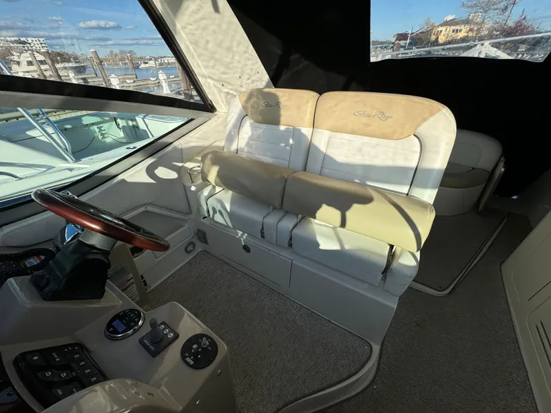 Slide: The Image of Interior of 2008 Sea Ray 310 Sundancer boat with helm and seating area. - 18