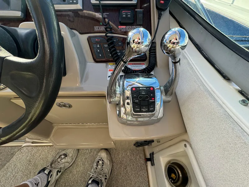 Slide: The Image of Control panel of a 2008 Sea Ray 310 Sundancer boat with dual throttle levers. - 21