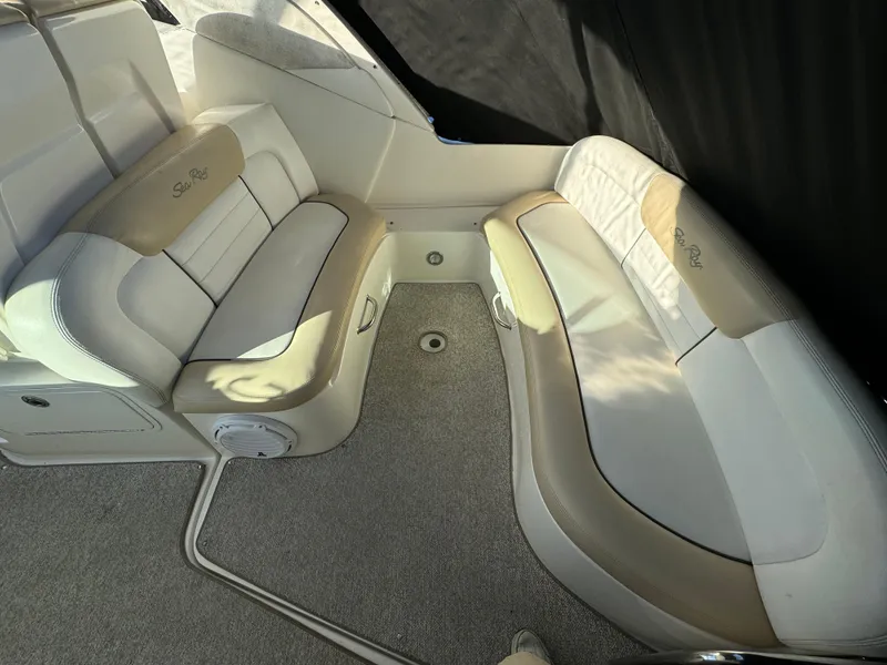 Slide: The Image of 2008 Sea Ray 310 Sundancer interior with beige and white seating. - 24