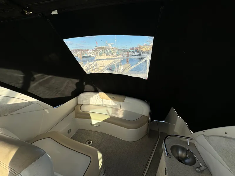 Slide: The Image of Interior of 2008 Sea Ray 310 Sundancer boat with seating and window view. - 25