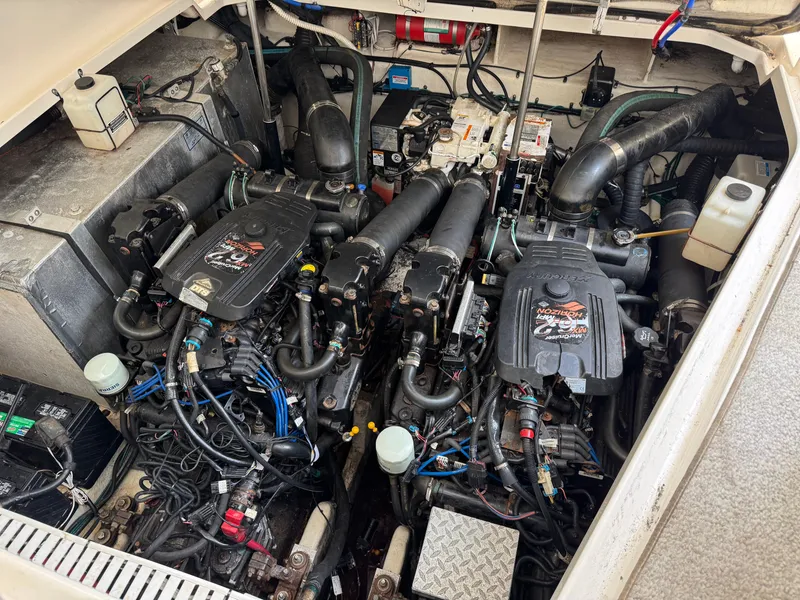 Slide: The Image of Engine compartment of a 2008 Sea Ray 310 Sundancer boat, showcasing dual engines and components. - 29