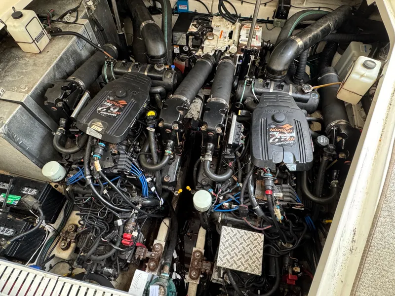 Slide: The Image of Engine compartment of a 2008 Sea Ray 310 Sundancer boat, showcasing dual engines. - 31