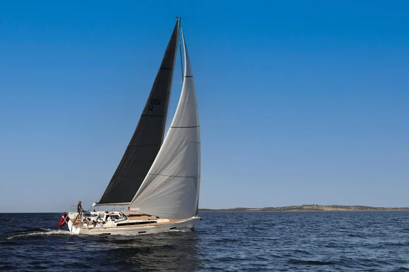 Slide: The Image of 2026 X-Yachts X4 3 sailing on open water under clear blue sky. - 2
