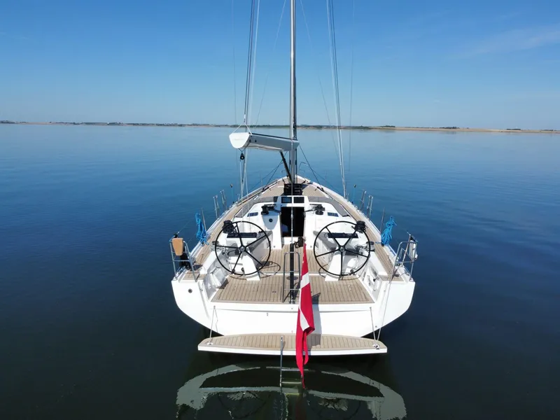 Slide: The Image of 2026 X-Yachts X4 3 sailboat on calm water, rear view, clear sky. - 5