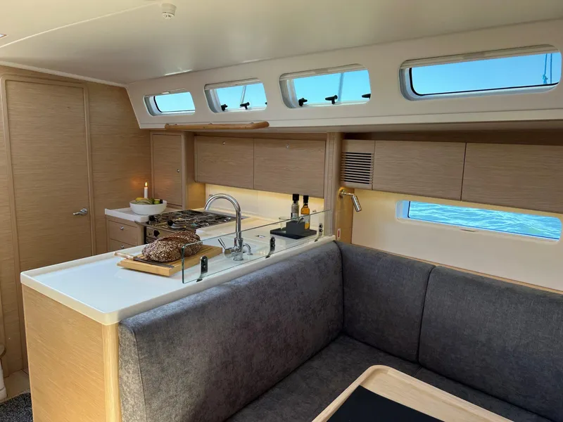 Slide: The Image of Modern interior of 2026 X-Yachts X4 3, featuring sleek kitchen and cozy seating area. - 6