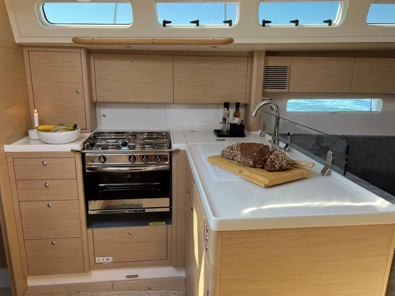 Slide: The Image of Modern kitchen in 2026 X-Yachts X4 3, featuring sleek cabinetry and stainless steel appliances. - 8