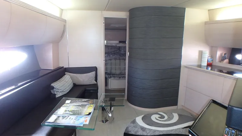 Slide: The Image of Interior of 2006 Azimut Atlantis 55 yacht, featuring modern seating and stylish decor. - 11