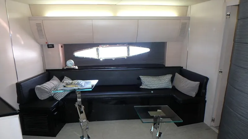 Slide: The Image of Interior of 2006 Azimut Atlantis 55 yacht with modern seating and glass tables. - 12