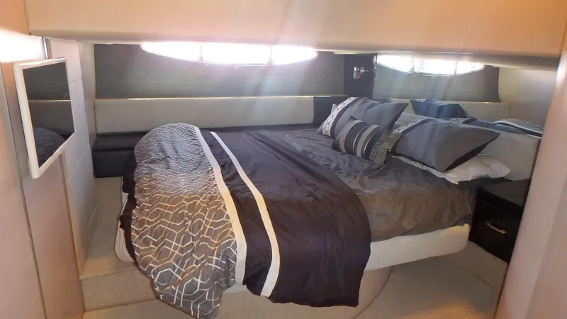 Slide: The Image of Luxurious bedroom interior of 2006 Azimut Atlantis 55 yacht with modern bedding. - 16