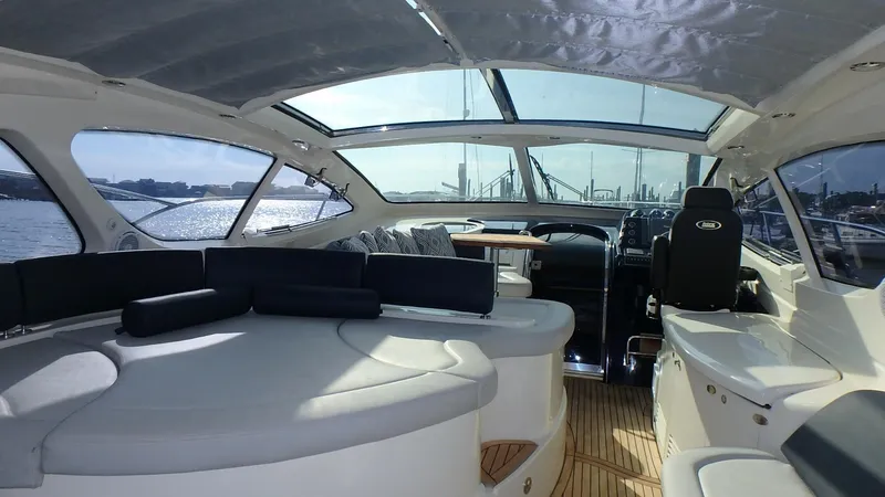Slide: The Image of Interior of 2006 Azimut Atlantis 55 yacht with spacious seating and panoramic windows. - 2