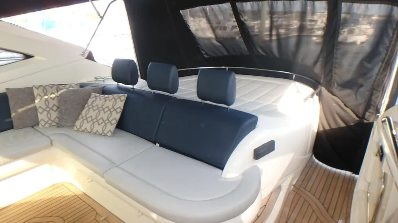 Slide: The Image of 2006 Azimut Atlantis 55 yacht interior with cushioned seating and decorative pillows. - 4