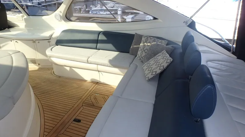 Slide: The Image of Luxurious interior of 2006 Azimut Atlantis 55 yacht with elegant seating and wooden flooring. - 5