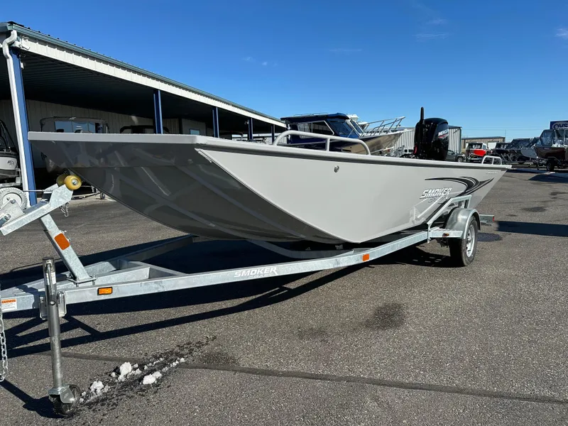 Slide: The Image of 2025 Smoker Craft Sportsman Pro 1866 boat on trailer in outdoor lot. - 1