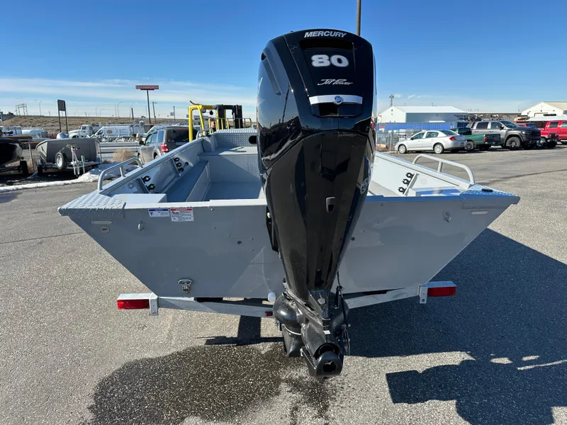 Slide: The Image of 2025 Smoker Craft Sportsman Pro 1866 boat with Mercury 80 engine, parked outdoors. - 4