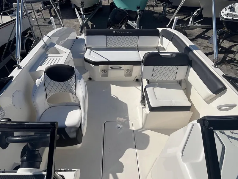 Slide: The Image of 2021 Bayliner DX 2200 boat interior with spacious seating and modern design. - 6