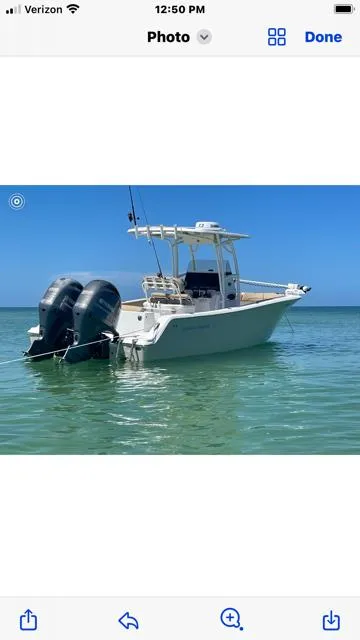 Slide: The Image of 2016 Sportsman HERITAGE 252 boat with dual engines on clear water. - 1