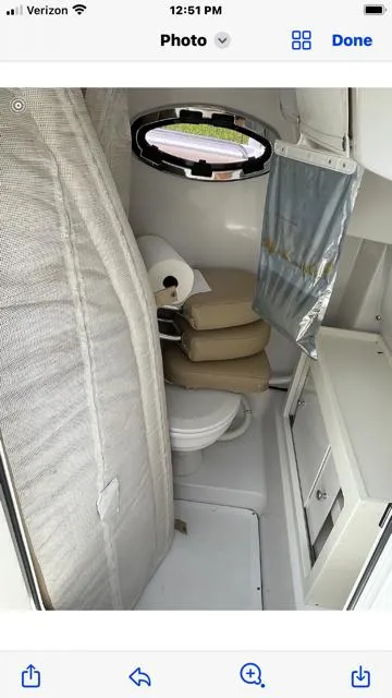 Slide: The Image of 2016 Sportsman HERITAGE 252 boat interior with compact bathroom and storage. - 10