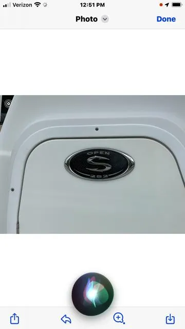 Slide: The Image of 2016 Sportsman HERITAGE 252 boat emblem on white surface. - 11