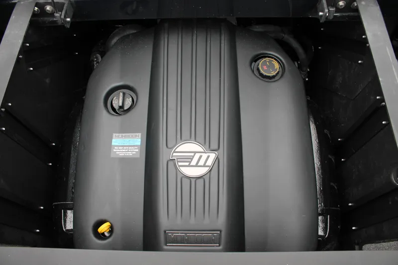 Slide: The Image of 2025 Malibu 23 MXZ engine compartment showcasing sleek design and advanced engineering. - 13