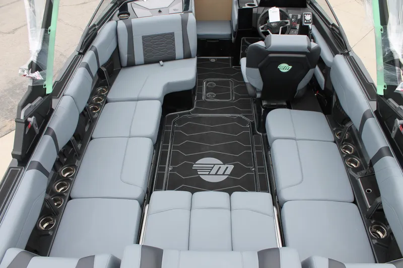 Slide: The Image of 2025 Malibu 23 MXZ boat interior with spacious seating and modern design. - 3
