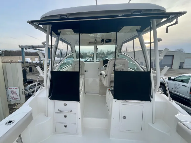 Slide: The Image of 2022 Boston Whaler 285 Conquest boat interior with seating and storage compartments. - 9