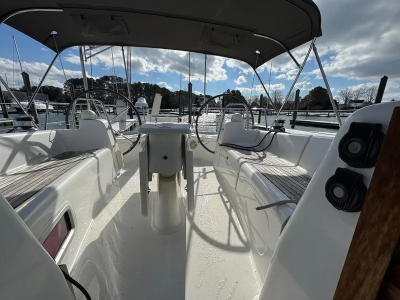 Slide: The Image of Beneteau 40 sailboat cockpit, 2012 model, featuring dual steering wheels and spacious seating. - 10
