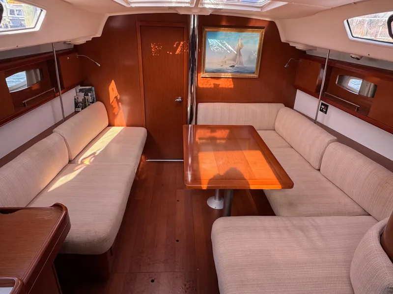 Slide: The Image of Spacious interior of 2012 Beneteau 40 yacht with elegant wood finish and comfortable seating. - 21