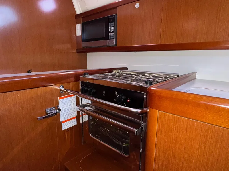 Slide: The Image of Galley kitchen in 2012 Beneteau 40 yacht with stove and microwave. - 28