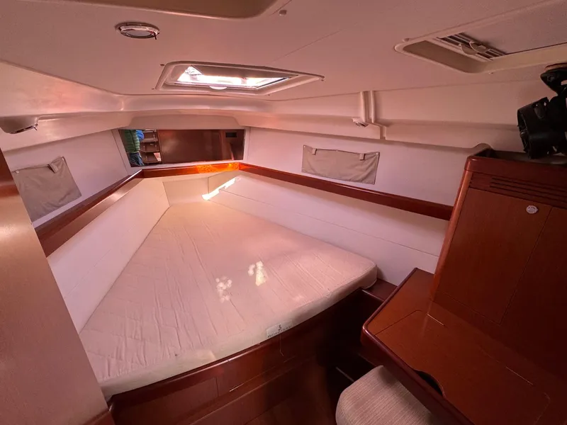 Slide: The Image of Cozy cabin interior of 2012 Beneteau 40 yacht with wooden accents and natural light. - 33