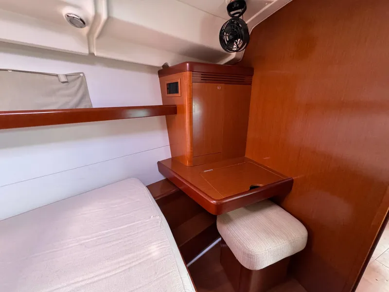 Slide: The Image of Cozy cabin interior of 2012 Beneteau 40 yacht with wooden finish and seating area. - 37