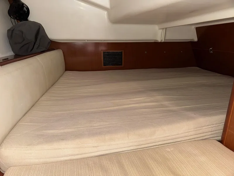 Slide: The Image of Cozy cabin interior of 2012 Beneteau 40 sailboat with cushioned bed. - 38